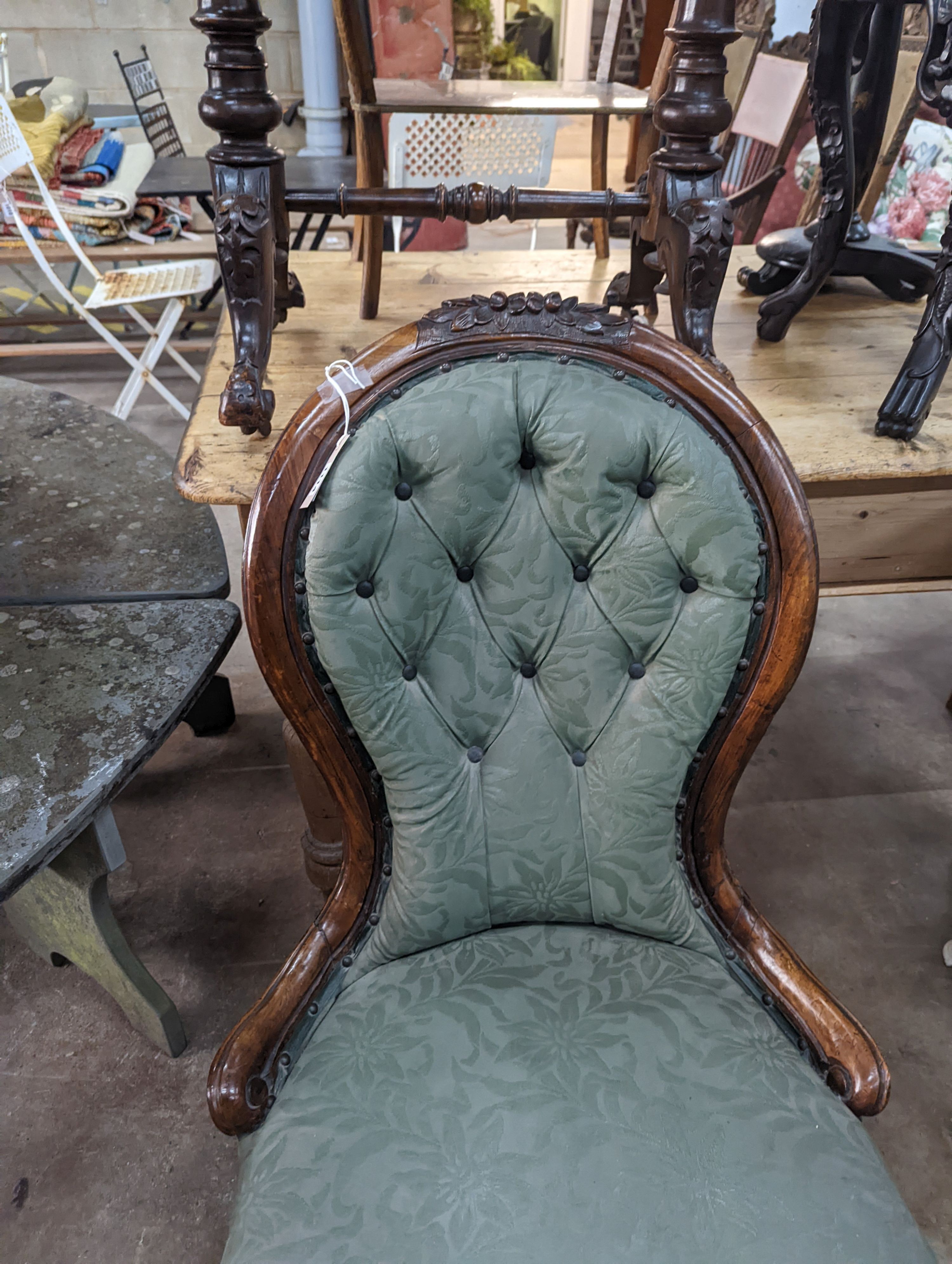 A Victorian walnut spoon back nursing chair